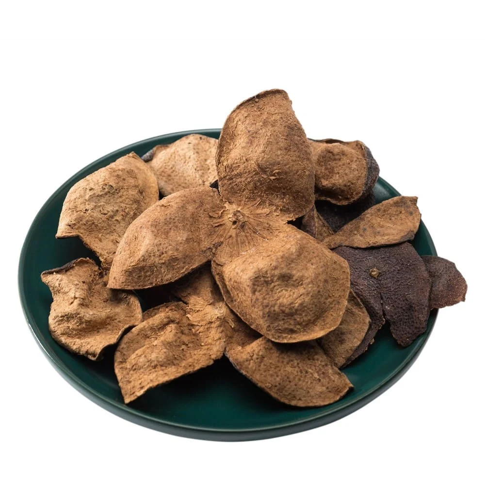 aged xinhui chenpi tangerine peel piled on a dark green plate