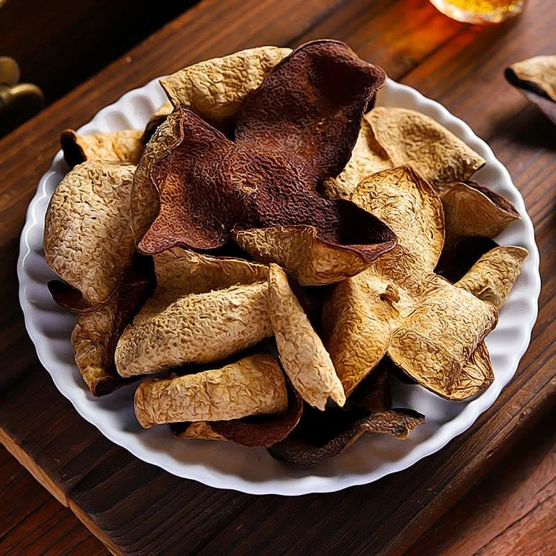 premium xinhui aged chenpi dried citrus peels served on white plate