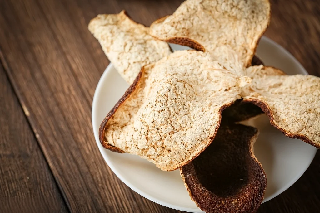 3-year xinhui chenpi light golden-brown peel on a plate