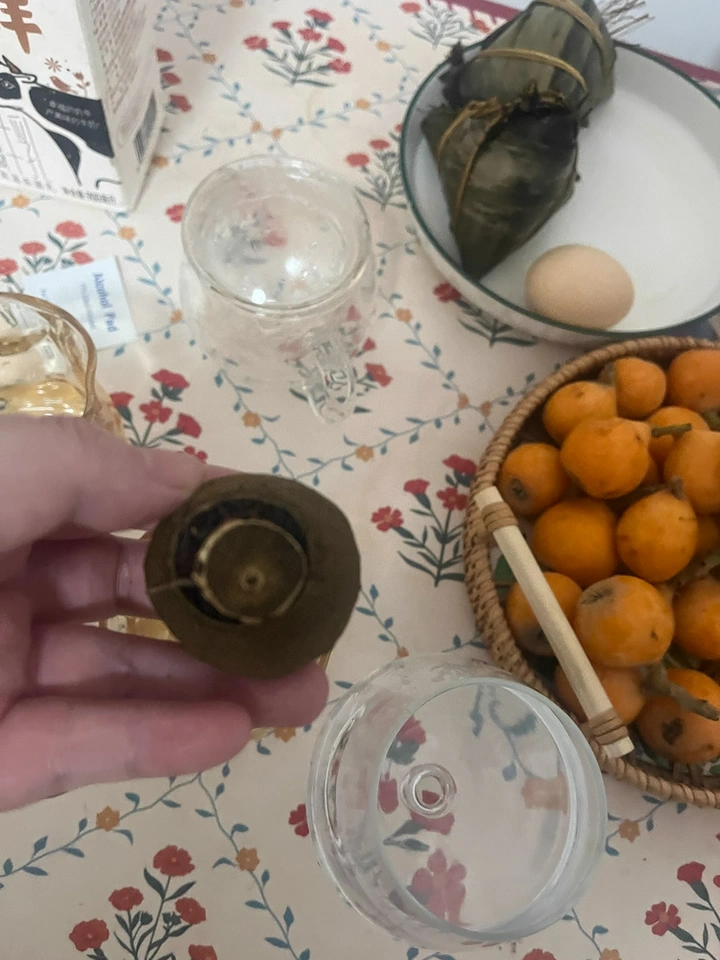 8 years of Xinhui XiaoQingGan Chenpi Pu'er Tea (Ripe Tea) photo review