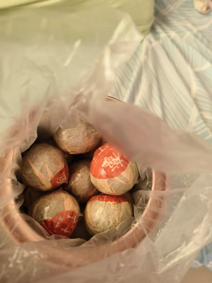 8 years of Xinhui XiaoQingGan Chenpi Pu'er Tea (Ripe Tea) photo review